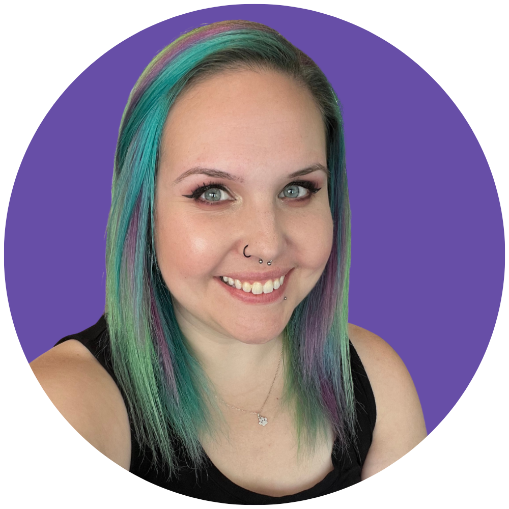 A picture of Brooklyn with blue, green and pink hair wearing a black tank top in front of a purple background